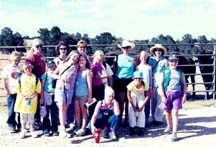 Surrounded by kids, Marlene is a natural born educator!